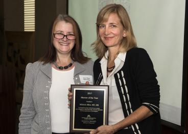 Dr. Michele Allen and Award Plaque