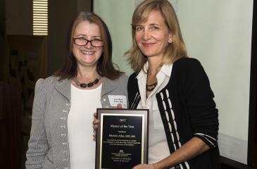 Dr. Michele Allen and Award Plaque