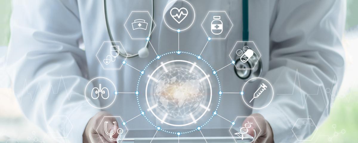 Doctor holding a tablet with health informatics icons overlaid 