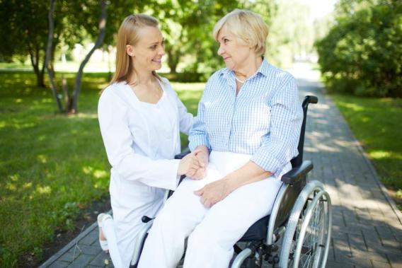 Nurse and woman in a wheelchair